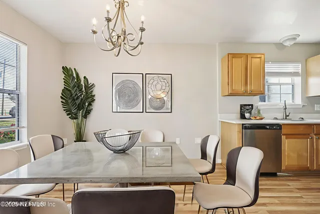 a dining room with furniture and window
