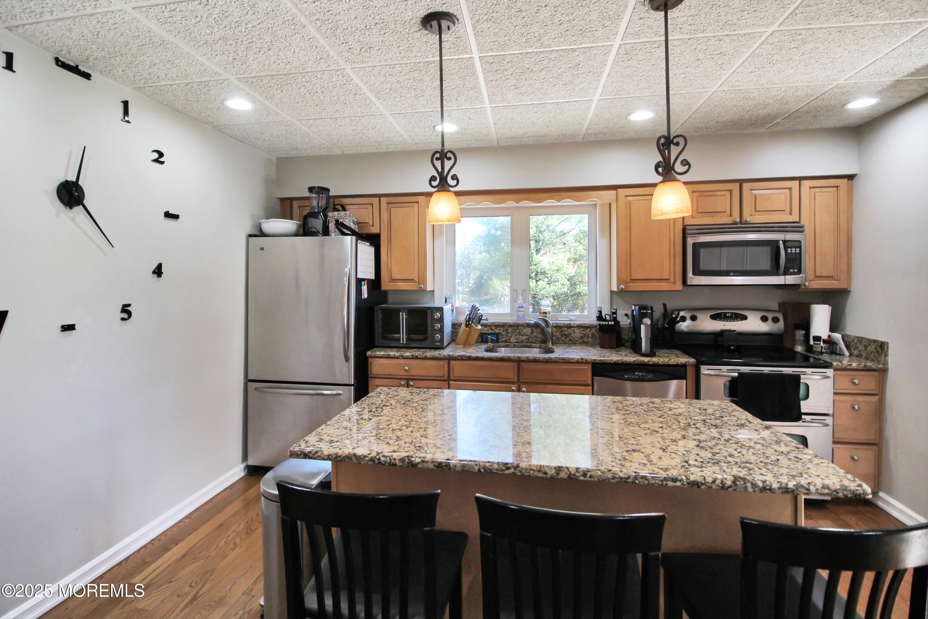 Cassville Road Jackson, NJ 08527 - Photo 9 of 22 a kitchen with stainless steel appliances granite countertop a sink refrigerator and microwave