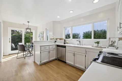 a kitchen with a sink and cabinets