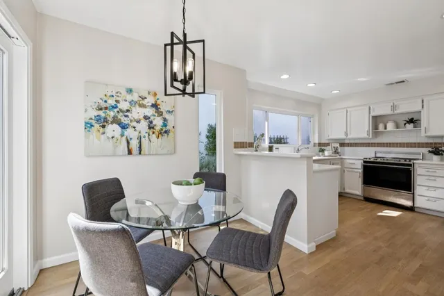 a dining room with furniture and a fireplace