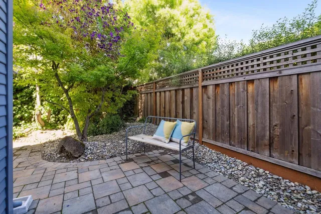a view of a chair and tables in the patio