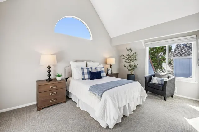 a bedroom with a bed and a couch