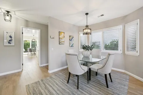 a dining room with furniture window wooden floor
