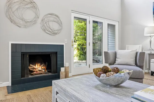 a living room with furniture and a fireplace