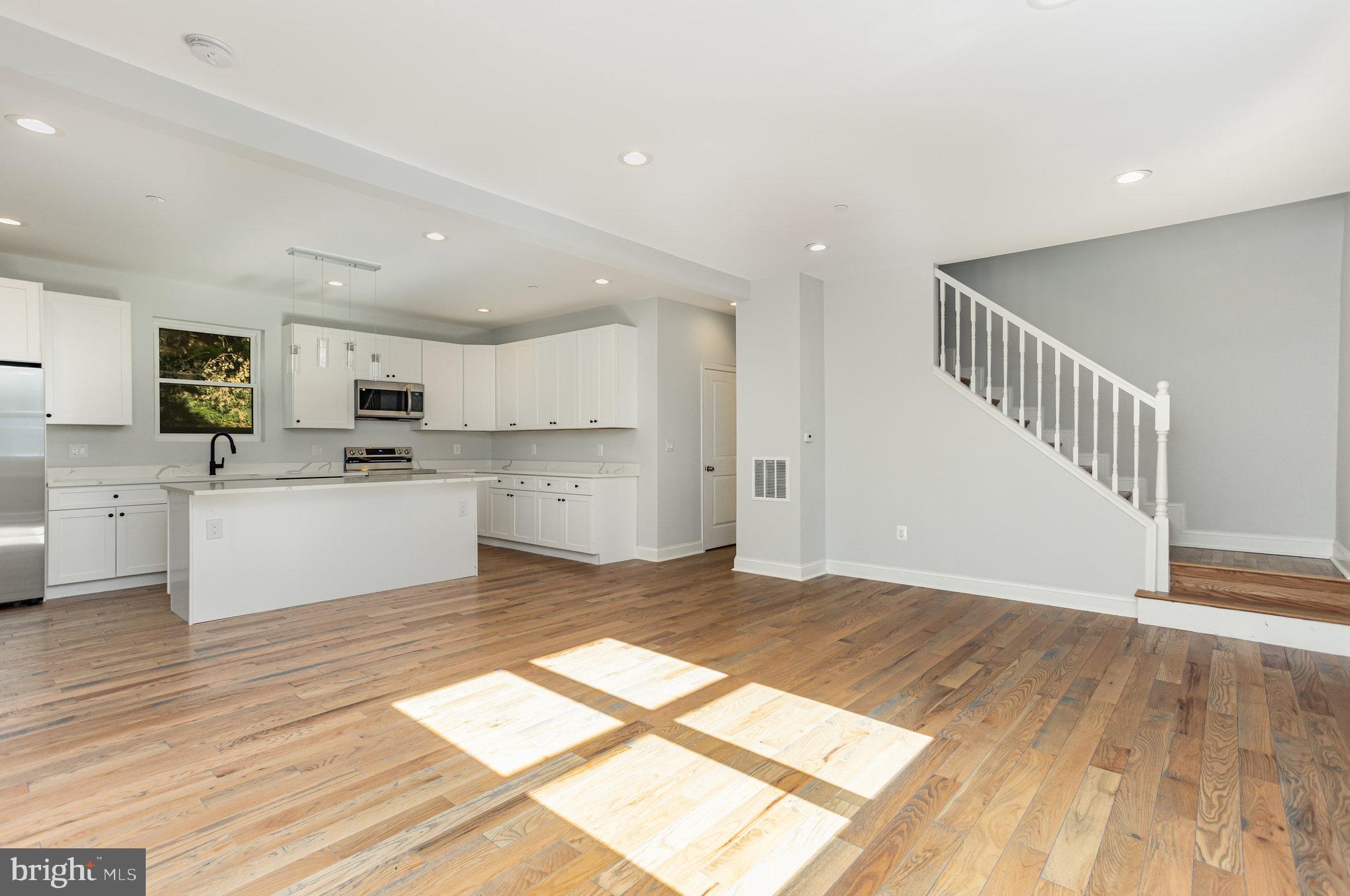 2430 Harris Mill Road Parkton, MD 21120 - Photo 11 of 68 a view of a kitchen with wooden floor and electronic appliances