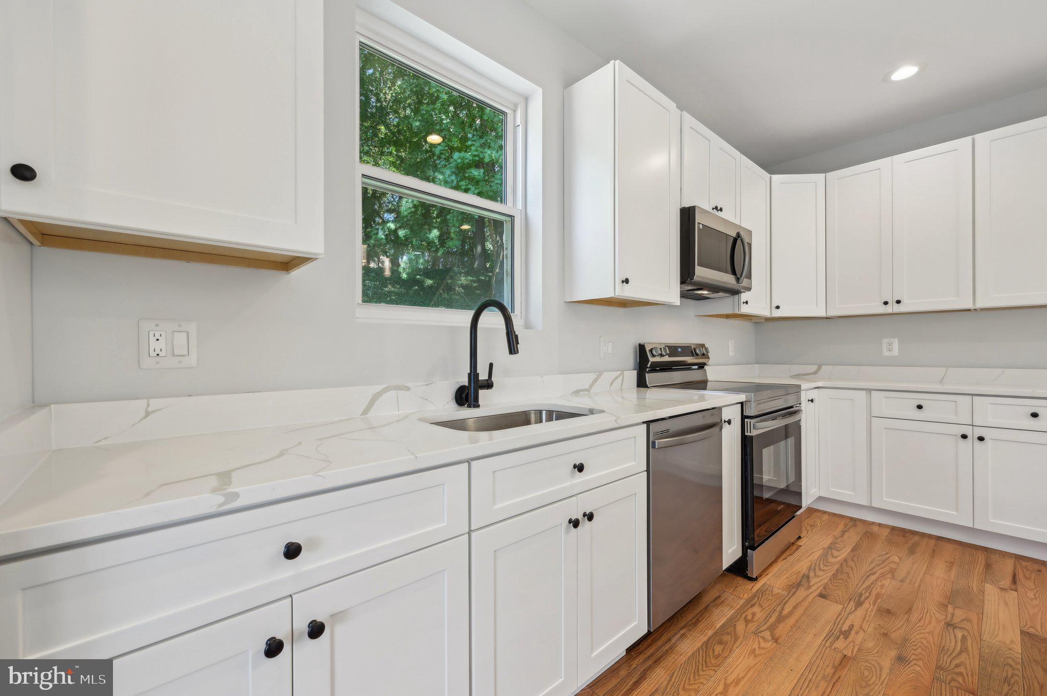 2430 Harris Mill Road Parkton, MD 21120 - Photo 18 of 68 a kitchen with appliances cabinets and a sink