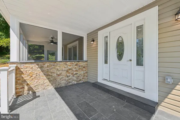 a room with a large window and a table