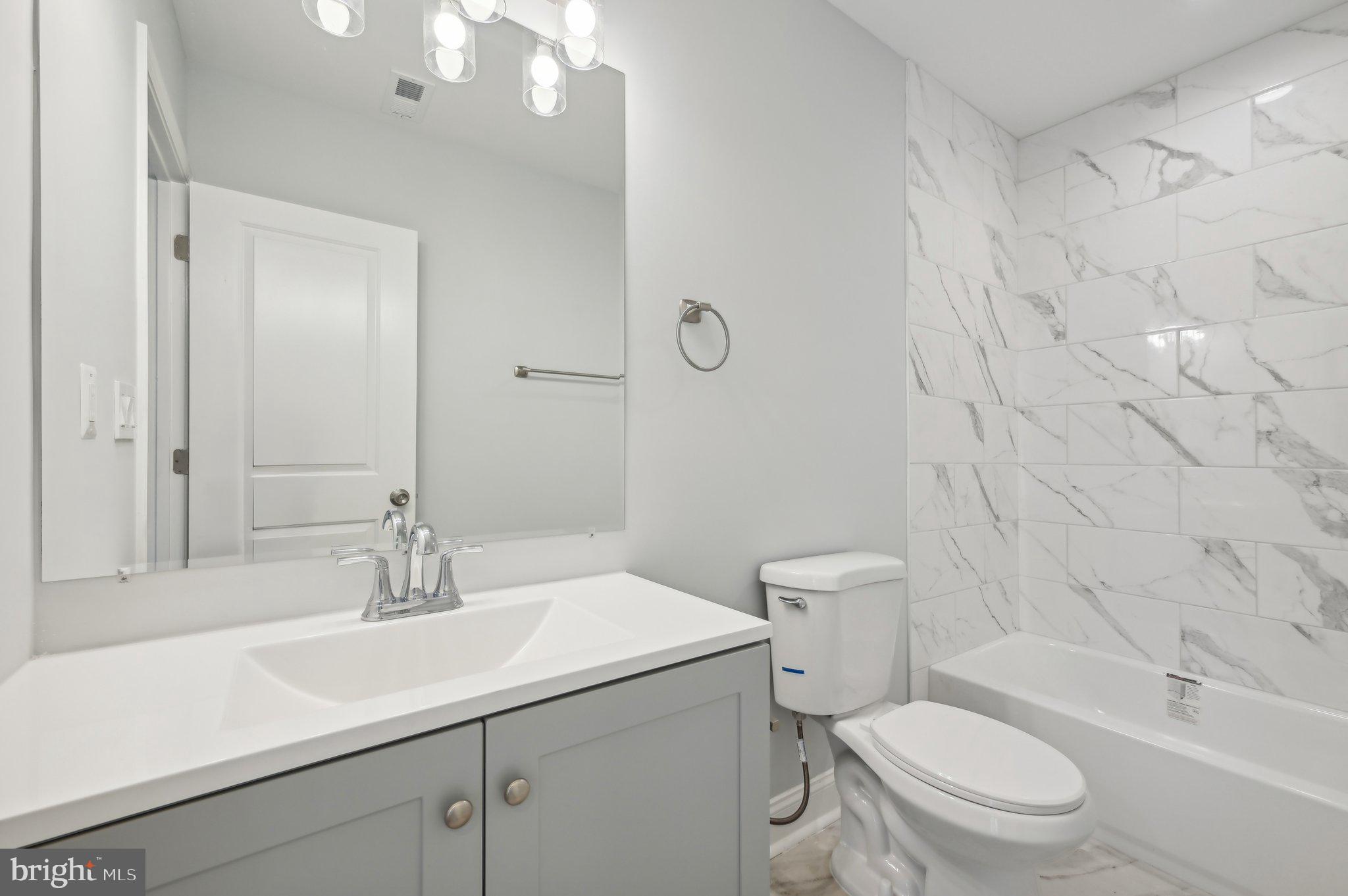 2430 Harris Mill Road Parkton, MD 21120 - Photo 43 of 68 a bathroom with a sink a toilet and shower