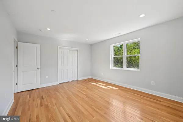 a view of hallway with wooden floor