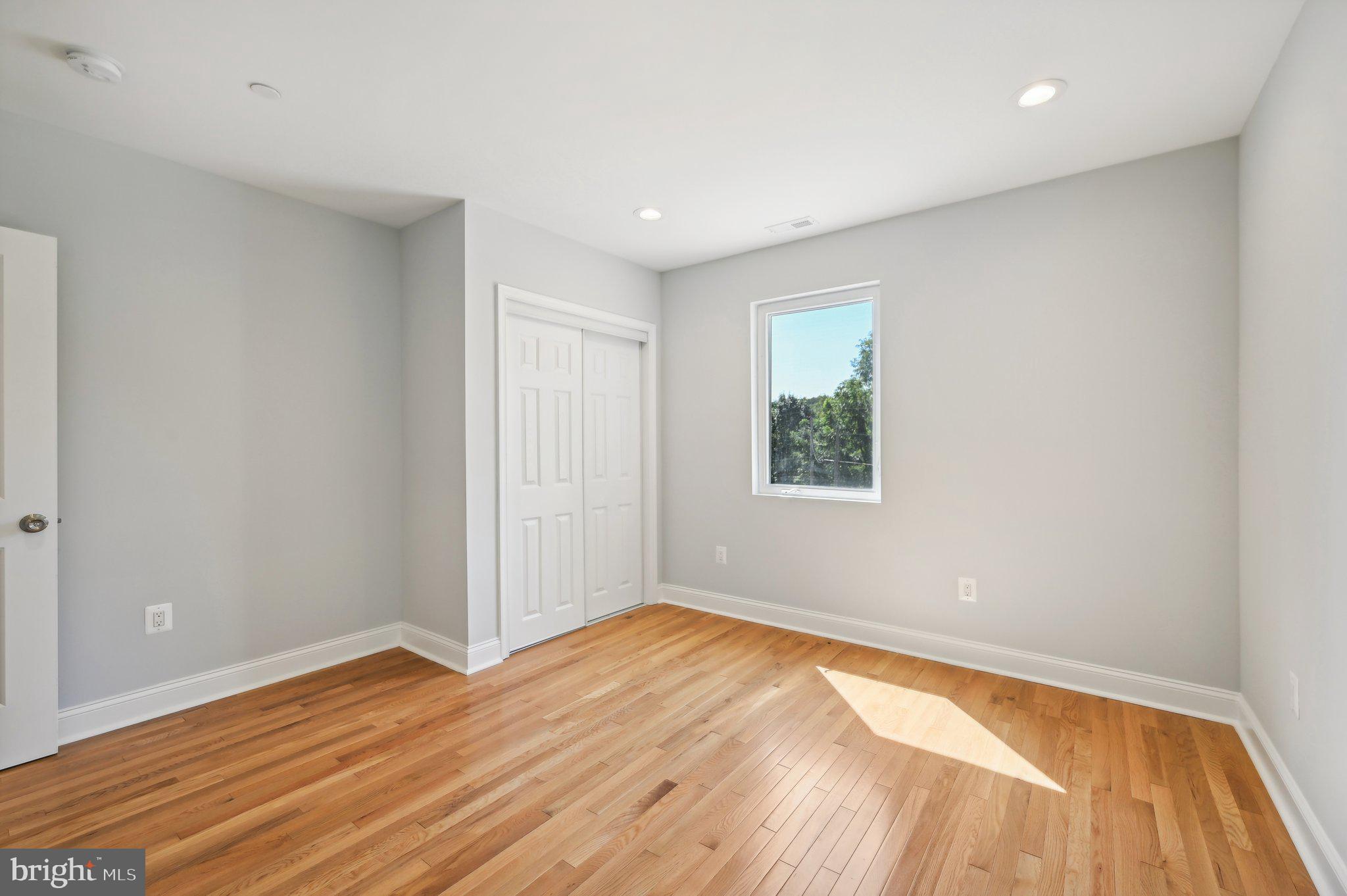 2430 Harris Mill Road Parkton, MD 21120 - Photo 49 of 68 a view of empty room with wooden floor and fan