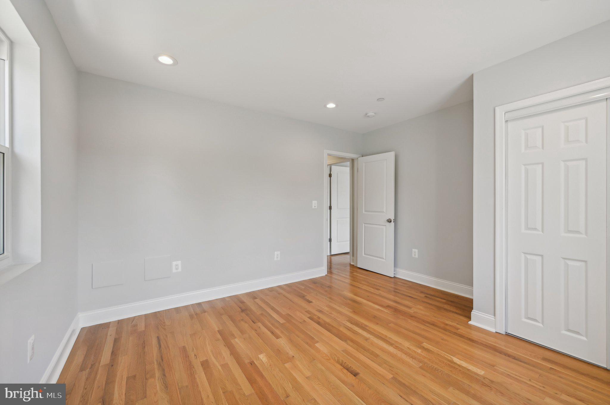2430 Harris Mill Road Parkton, MD 21120 - Photo 50 of 68 a view of an empty room with wooden floor