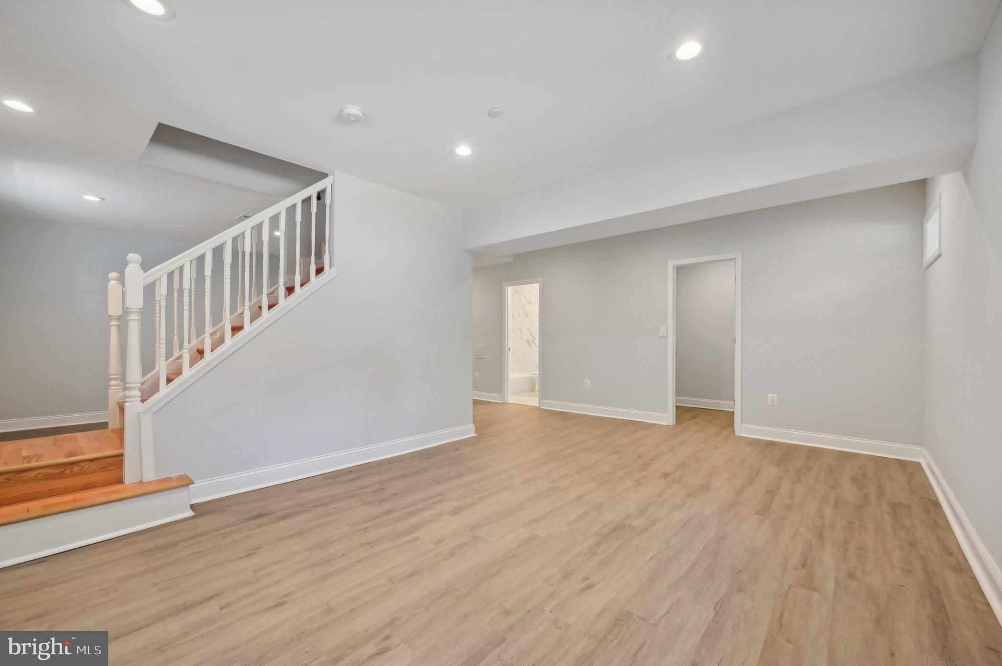 2430 Harris Mill Road Parkton, MD 21120 - Photo 52 of 68 a view of an empty room with wooden floor