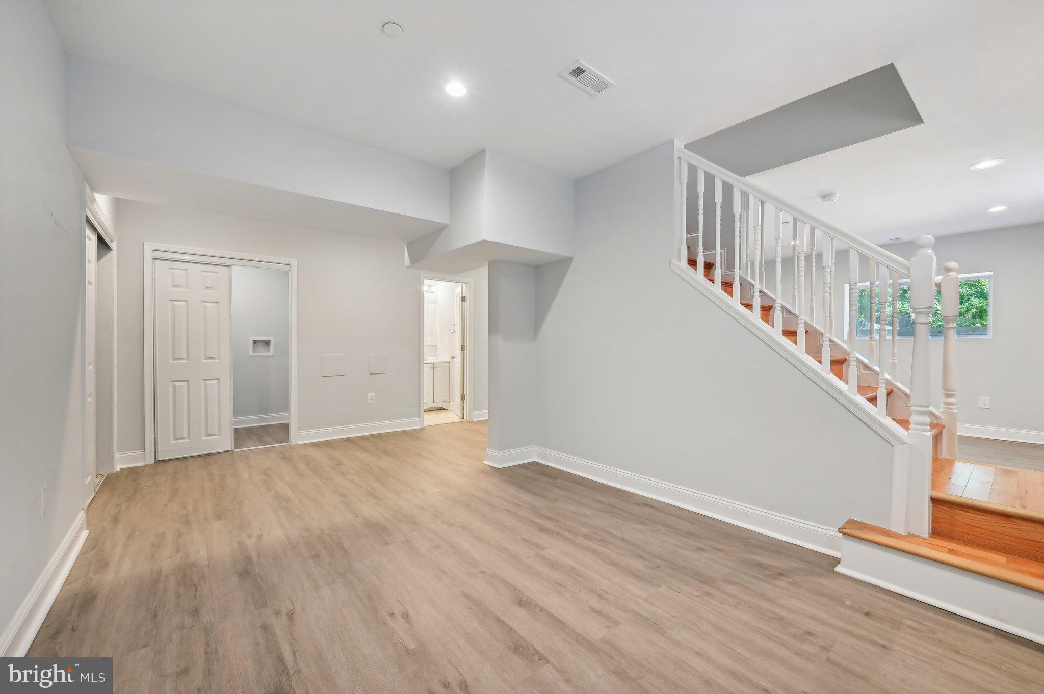 2430 Harris Mill Road Parkton, MD 21120 - Photo 53 of 68 a view of an empty room with wooden floor and stairs
