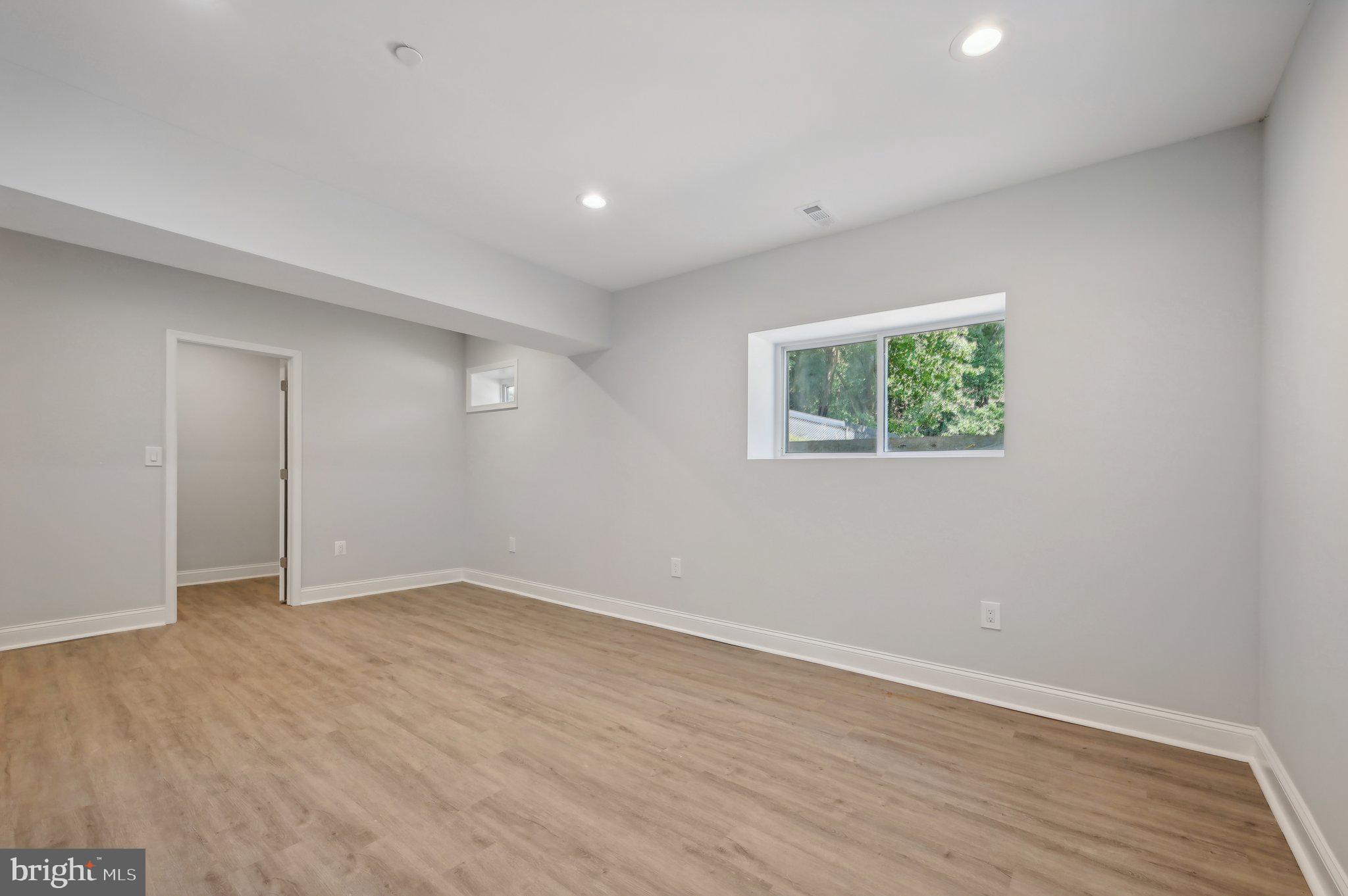 2430 Harris Mill Road Parkton, MD 21120 - Photo 55 of 68 a view of an empty room with wooden floor and a window
