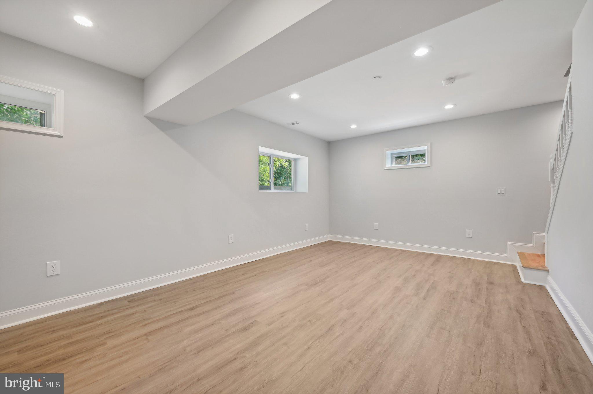2430 Harris Mill Road Parkton, MD 21120 - Photo 56 of 68 an empty room with wooden floor and windows