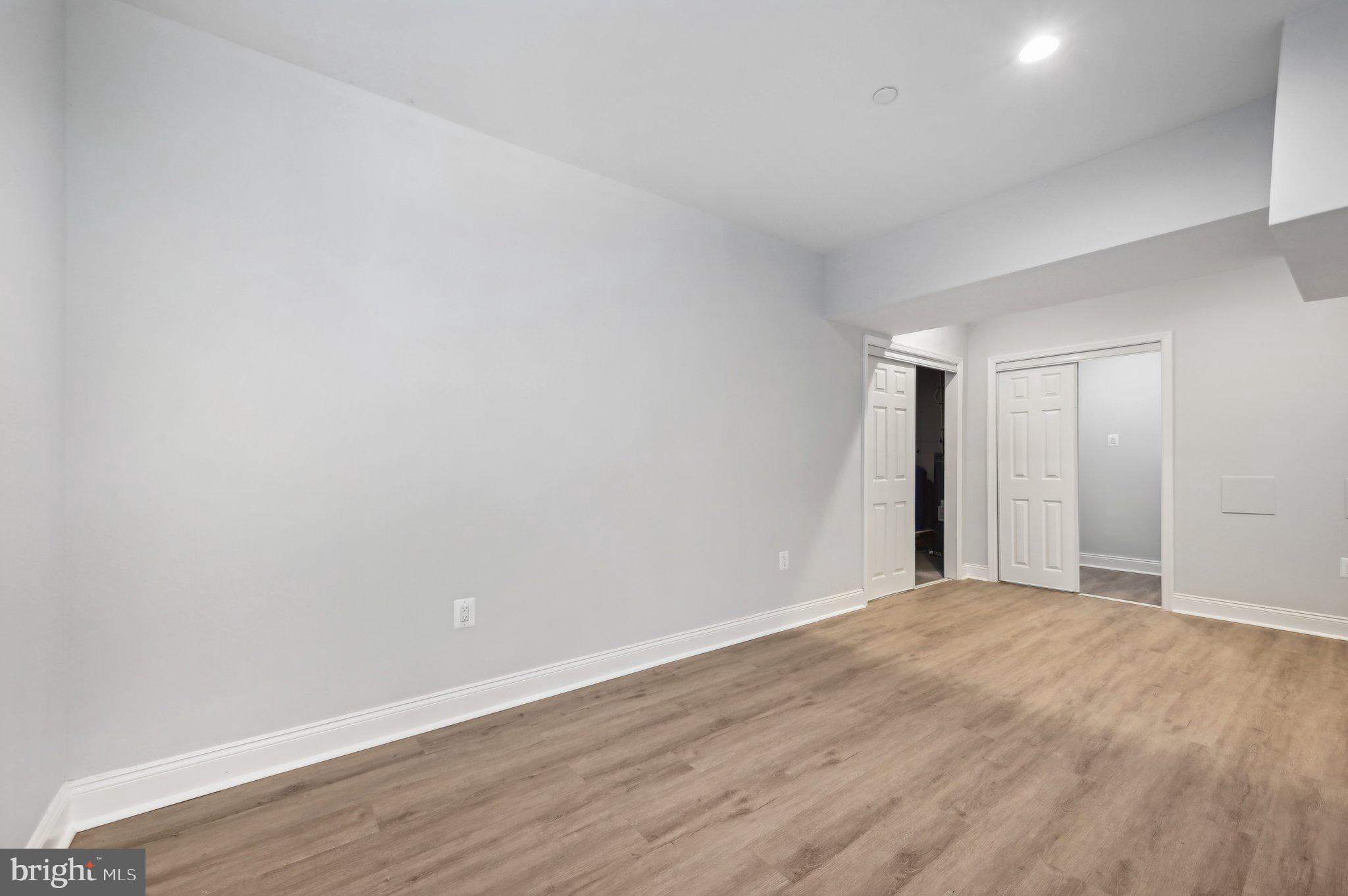 2430 Harris Mill Road Parkton, MD 21120 - Photo 59 of 68 a view of an empty room with wooden floor