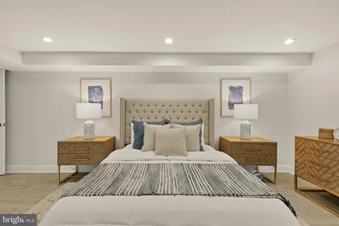 a bedroom with a bed and a lamp