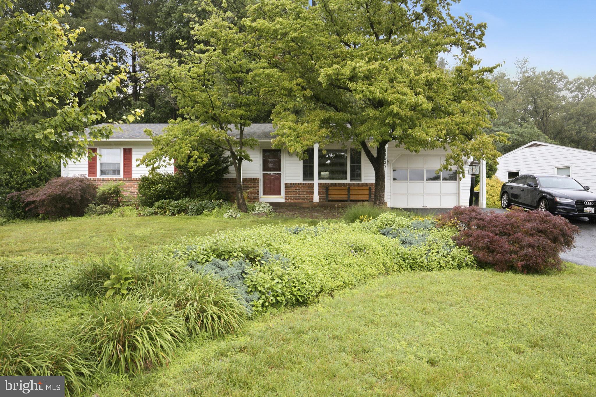 11937 Bayswater Road Gaithersburg, MD 20878 - Photo 54 of 55 Charming home embraced by lush greenery.
