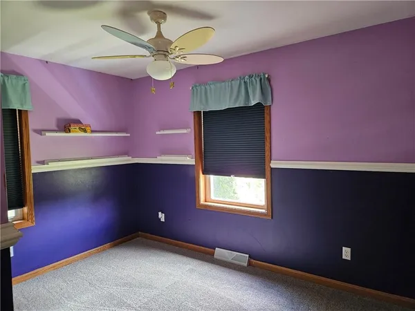 view of an empty room with a window