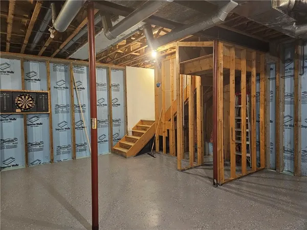 a view of a room with wooden walls