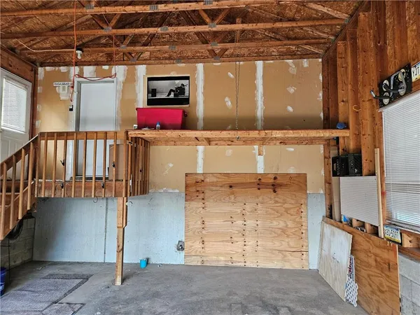 a view of a yard with potted plants