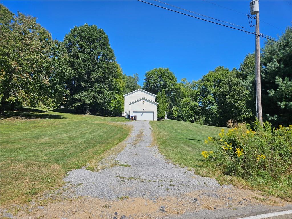 7715 Lamor Road Mercer, PA 16137 - Photo 28 of 30 a view of a yard with potted plants