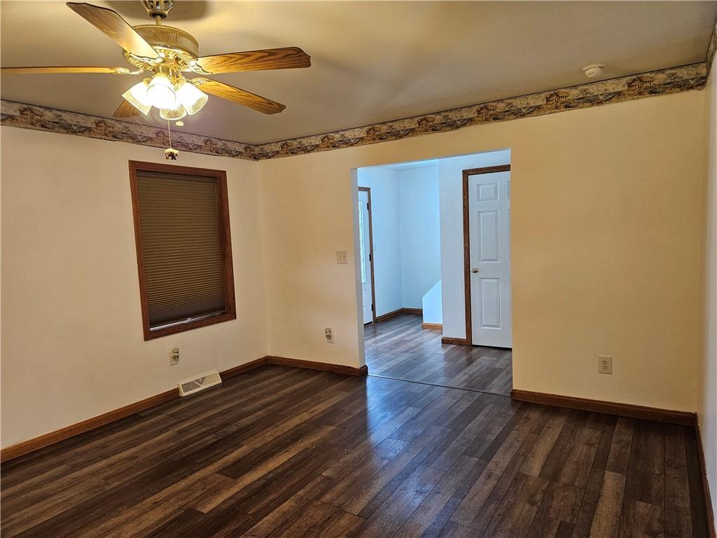 7715 Lamor Road Mercer, PA 16137 - Photo 3 of 30 a view of an empty room with wooden floor