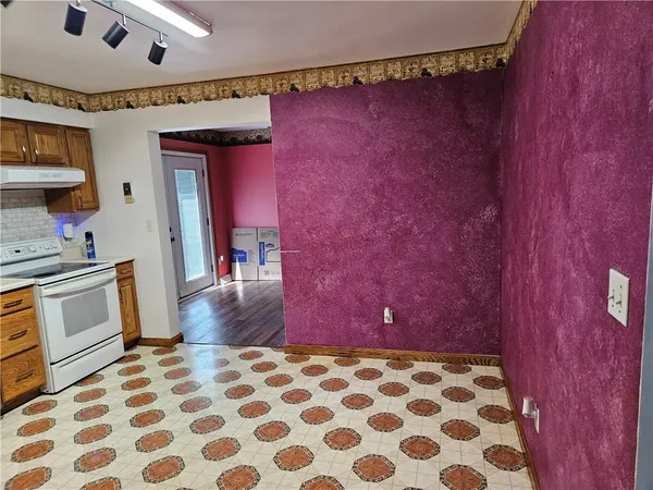 a hallway with a black white checkered floor