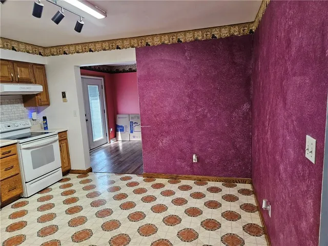 a hallway with a black white checkered floor