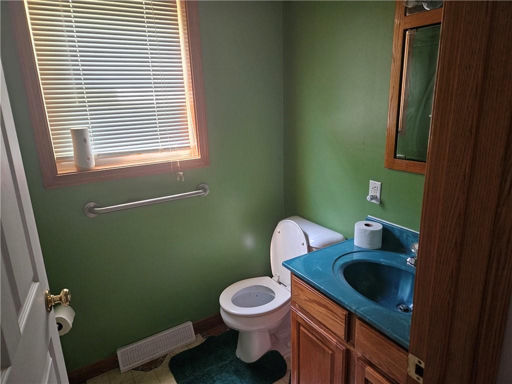 7715 Lamor Road Mercer, PA 16137 - Photo 9 of 30 a bathroom with a toilet sink and window