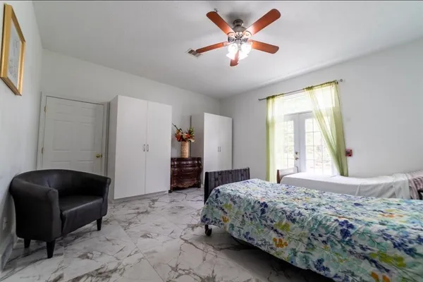 a bedroom with a bed and a dresser