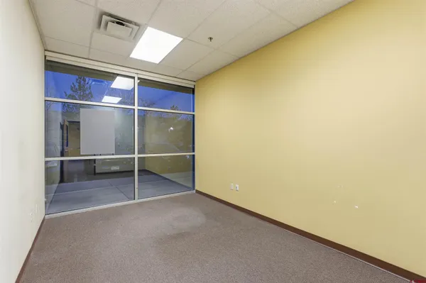 an empty room with walk in closet