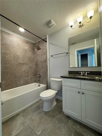 a bathroom with a shower sink and mirror