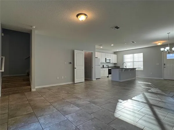 a kitchen with stainless steel appliances granite countertop a sink and cabinets