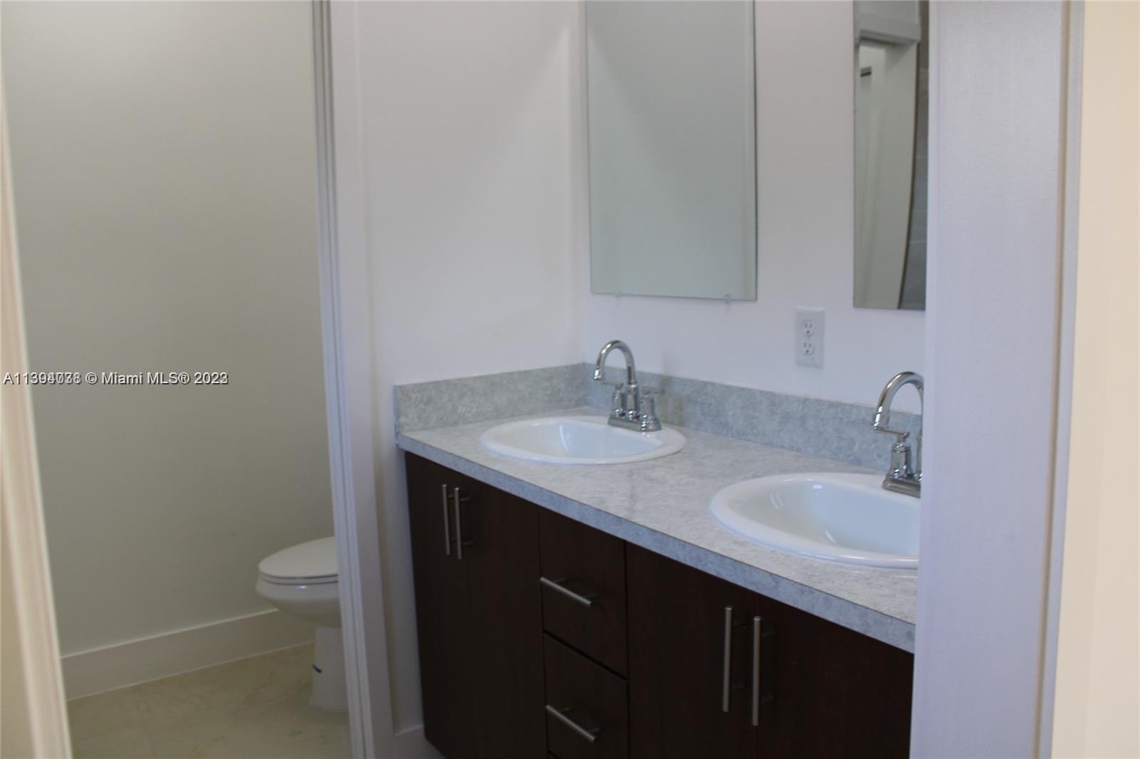 Blanche Ely Pompano Beach, FL 33060 - Photo 15 of 24 a bathroom with a sink and a toilet