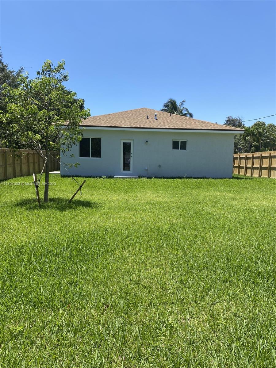 Blanche Ely Pompano Beach, FL 33060 - Photo 2 of 24 a front view of a house with a yard