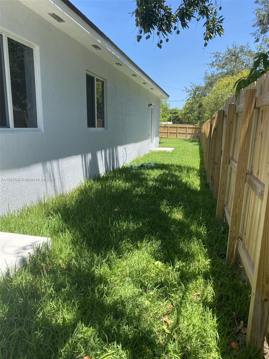 Blanche Ely Pompano Beach, FL 33060 - Photo 4 of 24 a backyard of a house with lots of green space