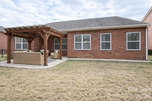 a front view of a house with outdoor seating