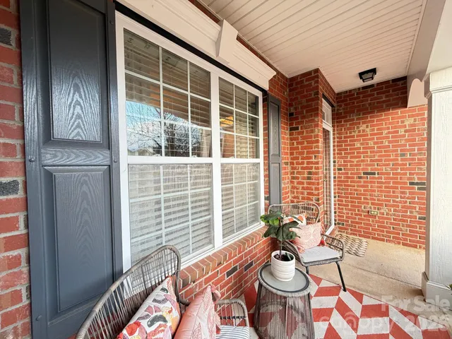 a view of a porch with seating space
