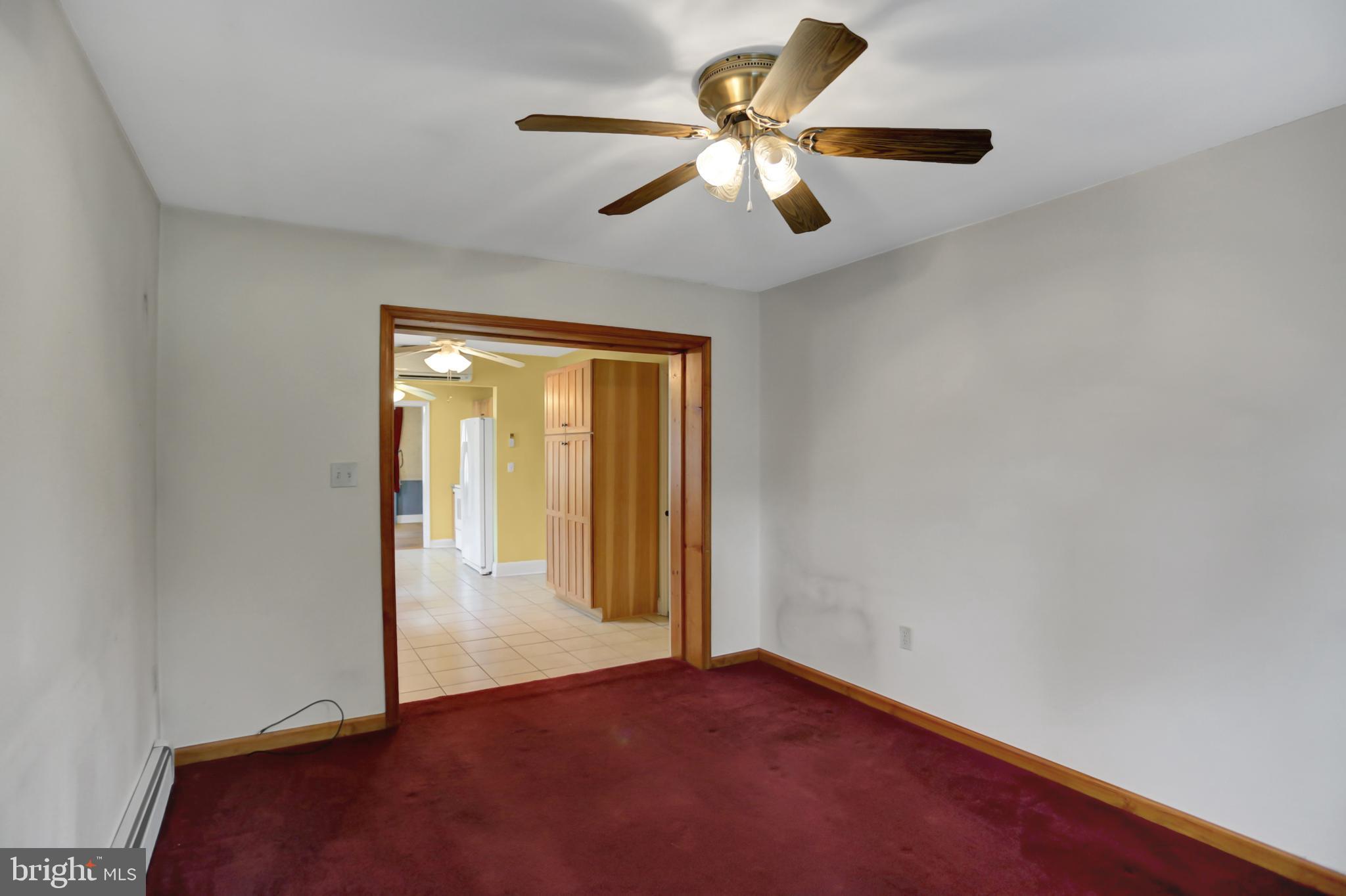 6119 Middleburg Road Keymar, MD 21757 - Photo 17 of 50 an empty room with a ceiling fan and a window