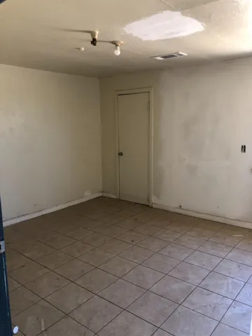 an empty room with a bathroom