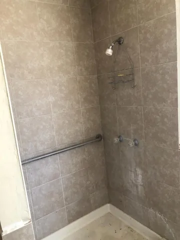 a view of swimming pool with a yard and trees