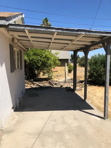 a bathroom with a toilet and a mirror