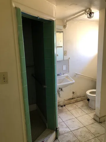 a backyard of a house with wooden fence