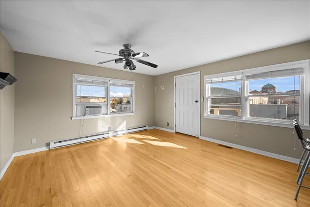 a view of an empty room with a window