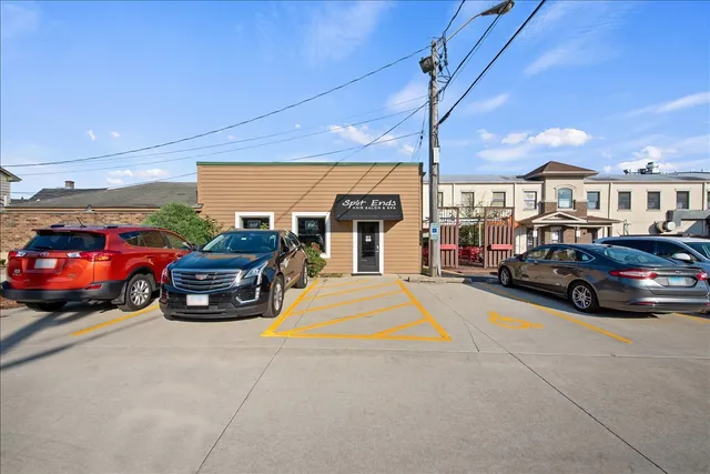 a view of a cars park in front of garage