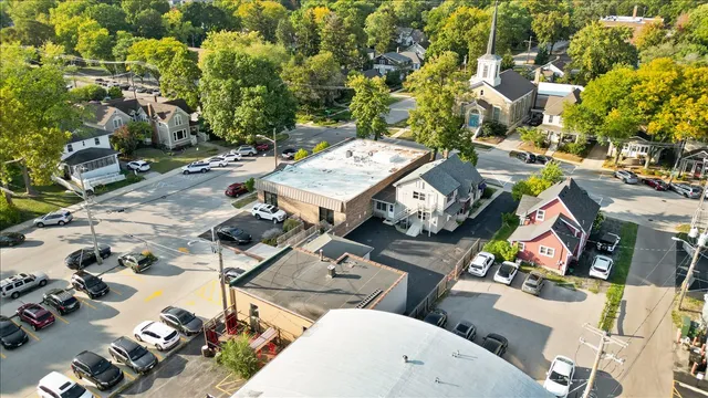 an aerial view of residential houses with outdoor space