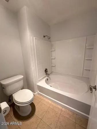 a view of empty room with wooden floor and cabinet