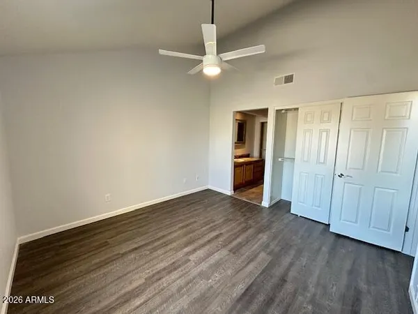 a view of an empty room and wooden floor