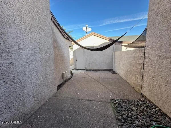 a view of a backyard with swimming pool